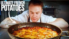 a man is looking at a large pan full of potatoes in front of him with the words ultimate french potato potatoes on it