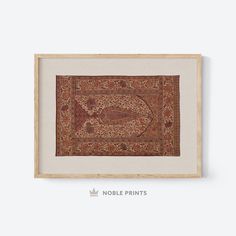 an antique persian rug is framed in a wooden frame on a white wall with the words noble prints