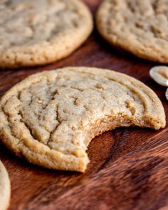 several cookies on a wooden table with a spoon