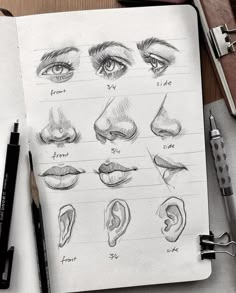 an open notebook with various types of eyes and nose