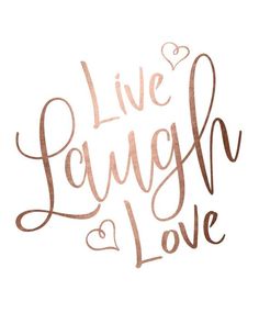 the words live laugh love written in copper ink