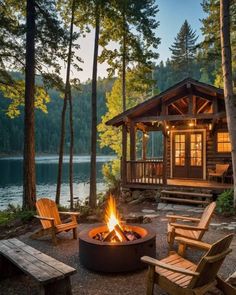 a fire pit sitting in front of a wooden cabin