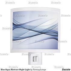 a white night light with blue waves on the screen and an outlet for plugs