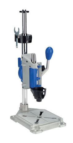 a machine that is sitting on top of a metal stand with two blue balls in it