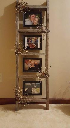 an old ladder is decorated with pictures and branches