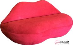 a large red couch sitting on top of a white floor