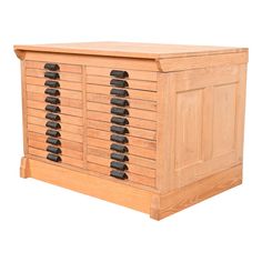 a wooden chest with black knobs on it