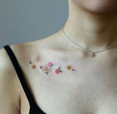 a woman's chest with flowers on it