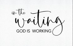 the words, in the waiting god is working on it's white background with black lettering