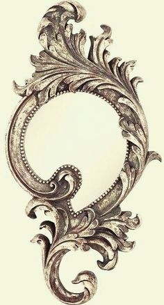 an ornate mirror is shown in the shape of a letter c, with intricate designs on it