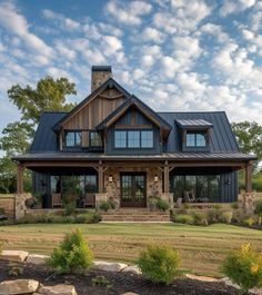 a large house with lots of windows and stone steps