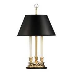 a table lamp with a black shade on the top and gold trimming around it