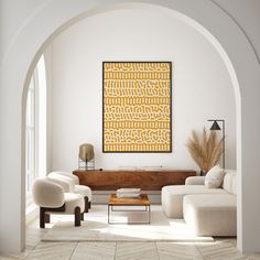 a living room filled with furniture and a painting hanging on the wall above it's doorway