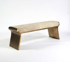 a bench made out of wood and fabric on a white background with no people around it