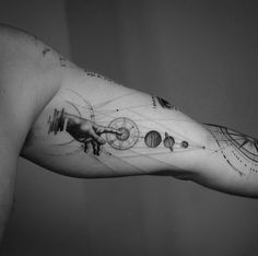 a man's arm with some drawings on it