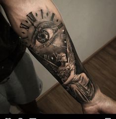 a man's arm with an eye and clock on it