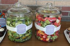 three glass jars filled with food on top of a table