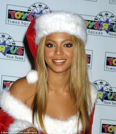 a woman wearing a santa suit and hat