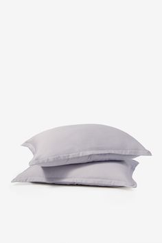 two pillows sitting on top of each other