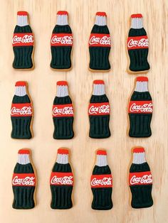 coca - cola cookies are arranged in rows on a table