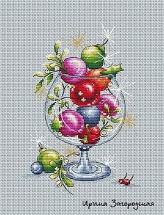 a cross stitch pattern with an image of a vase filled with fruit