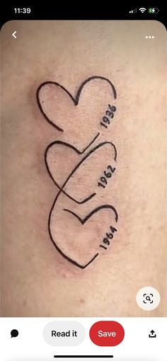 a tattoo with two hearts and the words i love you in cursive writing