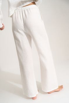 Effortless yet elevated, the 100% linen Drawstring Pant doesn't just lounge like a pro but travels like one, too. From the airplane to the pool, the hammock or the couch, these easy pull-on pants make everything a breeze. Linen Bottoms With Elastic Waistband For Lounging, Casual Linen Lounging Bottoms, Casual Linen Lounging Pants, Comfortable Wide Leg Pants For Summer Lounging, Comfortable Wide Leg Pants For Lounging In Summer, Chic Linen Bottoms For Loungewear, Chic Linen Loungewear Bottoms, Comfortable Linen Bottoms For Lounging, Relaxed Fit Pants For Summer Lounging