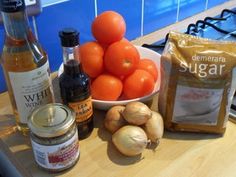 tomatoes, garlic and other ingredients on a counter top