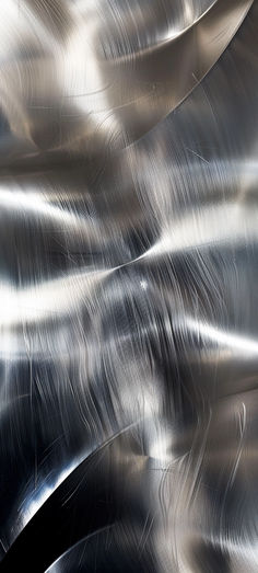 an abstract metal background that looks like it has been made with silver paint and is very shiny