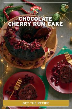 chocolate cherry rum cake on red plates with gold forks and christmas decorations in the background