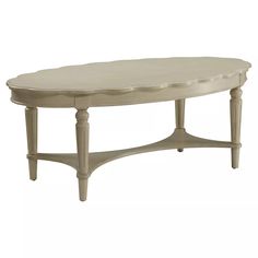 the oval table is made from wood and has a white finish on it's top