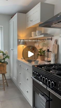 a kitchen with white cabinets and an oven