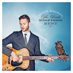 a man in a suit playing an acoustic guitar with an owl on his shoulder and the words work their best