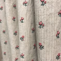 a close up view of the fabric with roses on it