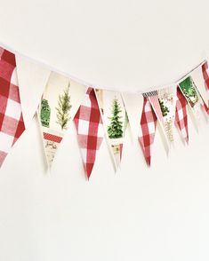 a red and white checkered bunting with trees on it