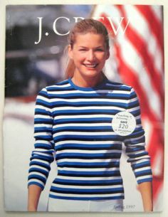 a woman in blue and white striped shirt with an american flag on the back ground