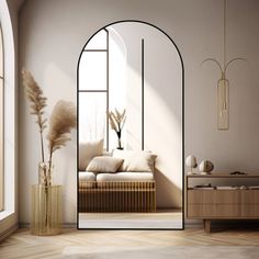 a living room with an arch shaped mirror next to a couch and vase filled with flowers