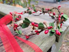 This elegant holiday vine headband is perfect for Christmas photos or any festive holiday event. This cute boho Christmas vine + berry crown tiara is made with a lightweight, flexible wrapped garden wire base, with green foam leafy vines and burgundy red pip berry accents intertwined around the headpiece. Choose a green, dark brown, sandy blonde, or platinum blonde base for your Boho Christmas Vine + Berry Tiara. The ends of the headband are wrapped for comfort. Removable burgundy ribbons are tied to the ends of your headband. Let them hang down long, or use them to tie your holiday leaf crown in the back.  This style of holiday crown is open in the back (it is not a continuous circle) but if you prefer a full circlet style, please message me before ordering.  **SIZING GUIDE**  Most smalls Vine Headband, Holiday Berries, Leaf Crown, Boho Flower Crown, Sandy Blonde, Christmas Headband, Boho Christmas, Holiday Gathering, Tiaras And Crowns