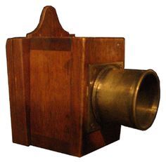 an old fashioned wooden camera is shown against a white background