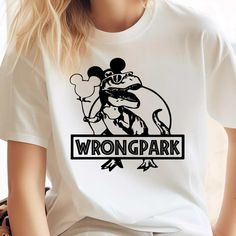 a woman wearing a white t - shirt with the word wrong park printed on it