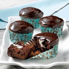 chocolate cupcakes with frosting on a plate