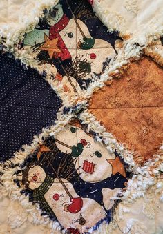 an old patchwork quilt with snowmen on it