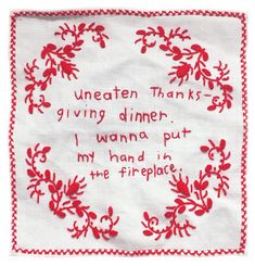 a red and white embroidered napkin with words on it that says, i vegetaten thanks giving dinner i wanna put my hand in the fire place