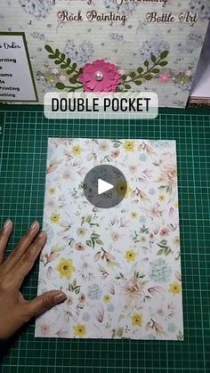 someone is making a flowered card with the words double pocket in front of it