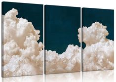 three canvases with white clouds against a blue sky