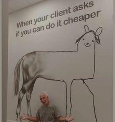 a man standing in front of a sign with a horse drawn on it's side