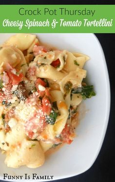 a white plate topped with pasta covered in sauce