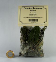 a bag of dried green leaves next to a coin on a white background with a yellow label