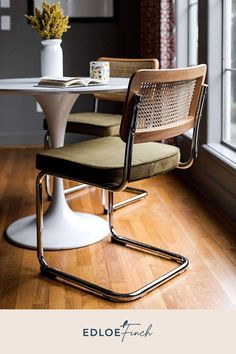 an image of a dining room setting with table and chairs on the floor in front of window