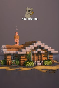 a building made out of blocks with a koala on the roof and trees around it